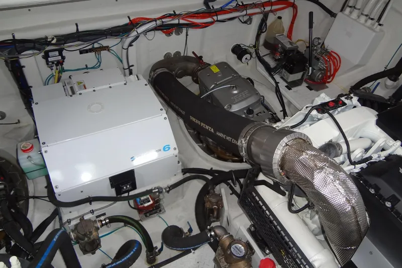 Imagine Yacht Photos Pics Engine room of 2021 Cruisers Yachts 50 Cantius, showcasing mechanical components and wiring.