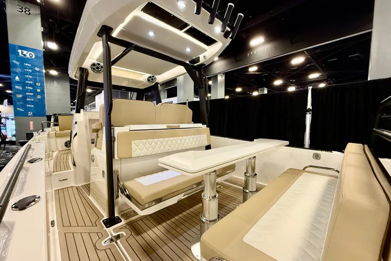  Yacht Photos Pics 2026 Zodiac X9CC boat interior with beige seating and modern design at a showroom.
