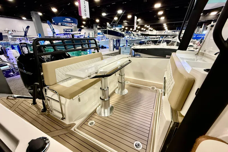  Yacht Photos Pics 2026 Zodiac X9CC boat interior with seating and table at a boat show.