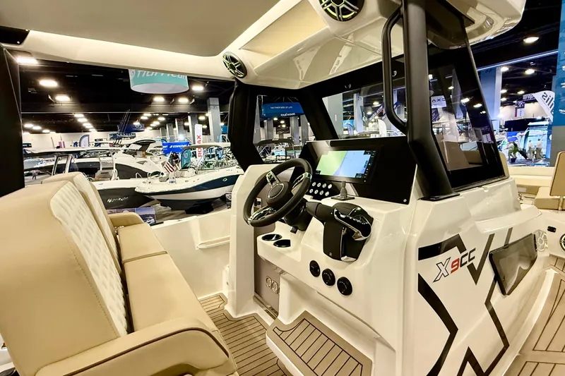  Yacht Photos Pics Interior view of 2026 Zodiac X9CC boat with modern dashboard and seating.