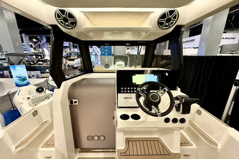  Yacht Photos Pics Interior view of 2026 Zodiac X9CC boat with modern steering and control panel.
