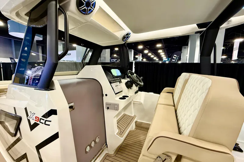  Yacht Photos Pics 2026 Zodiac X9CC boat interior with modern dashboard and beige seating.