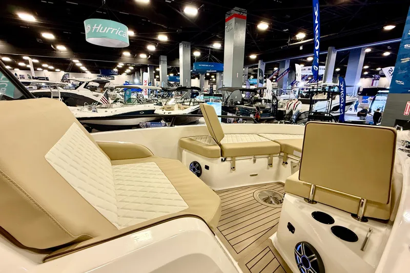  Yacht Photos Pics 2026 Zodiac X9CC boat interior at a boat show, featuring beige seating and modern design.