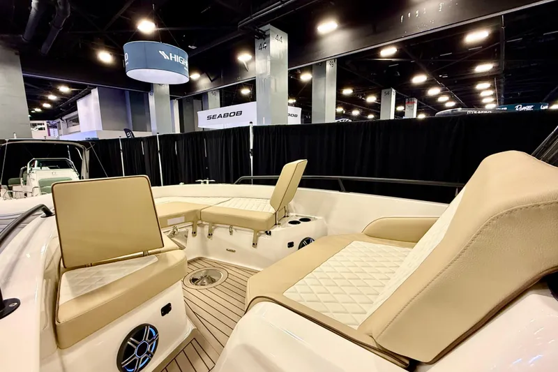  Yacht Photos Pics Interior of 2026 Zodiac X9CC boat with beige seating at a boat show.