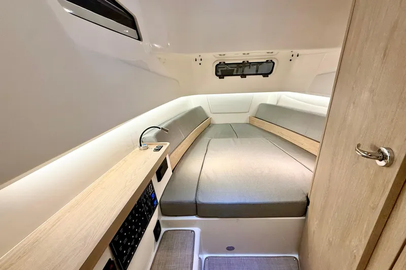  Yacht Photos Pics Cozy interior cabin of 2026 Zodiac X9CC boat with modern design and comfortable seating.