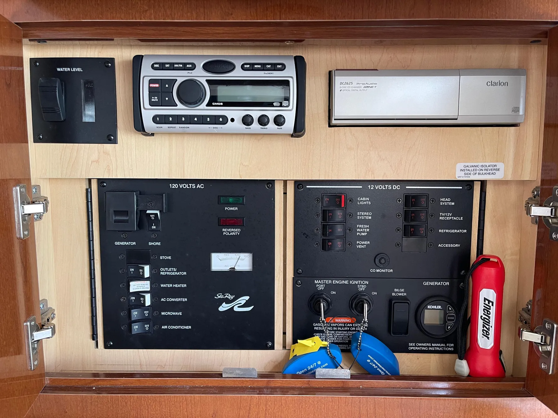 Control panel of a 2005 Sea Ray Amberjack 290 boat with stereo and electrical switches.