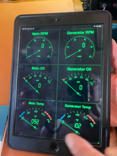 Mawe Yacht Photos Pics Tablet displaying engine diagnostics for Island Packet 440, 2006 model, showing RPM, oil, and temperature gauges.