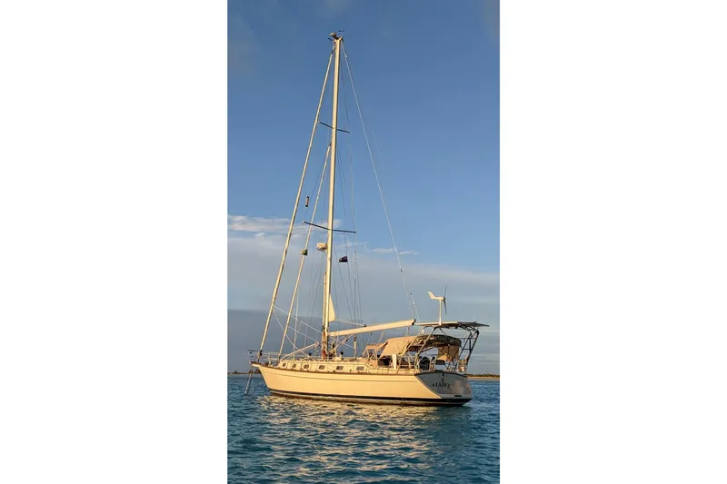 Mawe Yacht Photos Pics Sailing yacht Island Packet 440, 2006 model, anchored on calm blue waters.