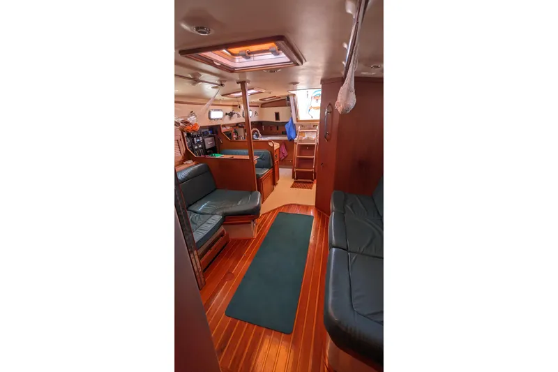 Mawe Yacht Photos Pics Interior of 2006 Island Packet 440 yacht with wood flooring and leather seating.