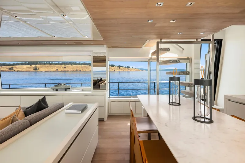 Essenza Yacht Photos Pics Luxurious interior of 2023 Sanlorenzo SL86 yacht with scenic ocean view.