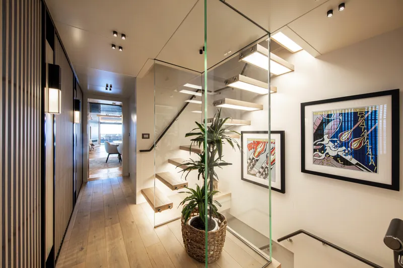 37xp-17 Yacht Photos Pics Modern interior of 2026 Numarine 37XP-17 yacht with stylish staircase and artwork.