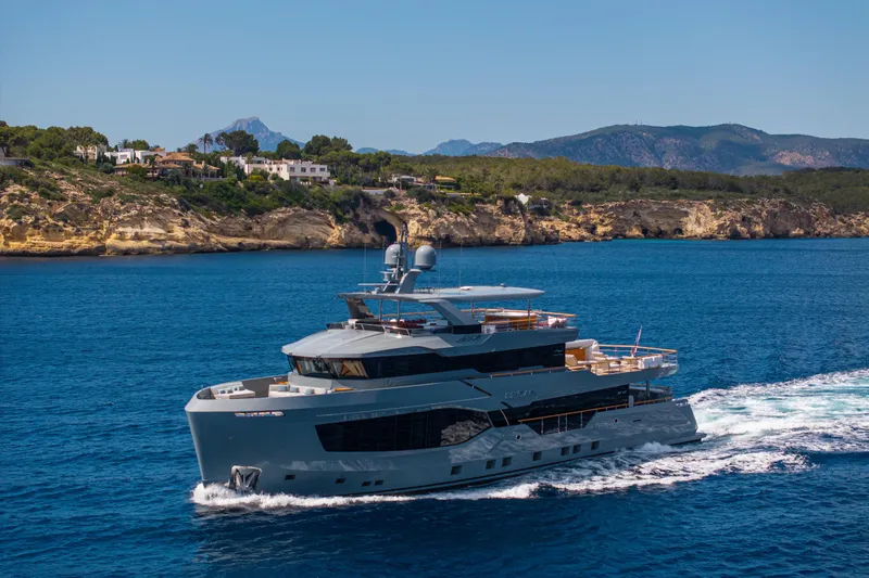 37xp-17 Yacht Photos Pics Luxurious 2026 Numarine 37XP-17 yacht cruising near scenic coastal cliffs.