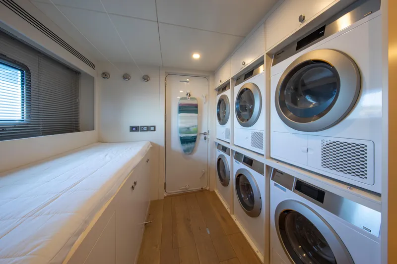 37xp-17 Yacht Photos Pics Laundry room on 2026 Numarine 37XP-17 yacht with modern appliances and sleek design.