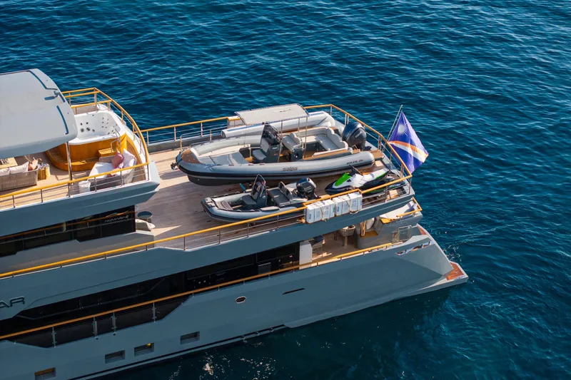 37xp-17 Yacht Photos Pics Luxury yacht Numarine 37XP-17 (2026) with tenders and flag, cruising on blue ocean waters.