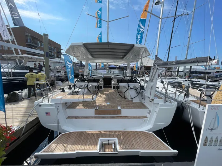 Uncorked Yacht Photos Pics 2023 Hanse 460 yacht at marina, showcasing modern design and spacious deck.