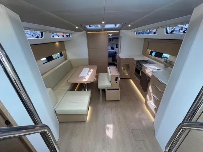 Uncorked Yacht Photos Pics Modern interior of 2023 Hanse 460 yacht with sleek kitchen and dining area.