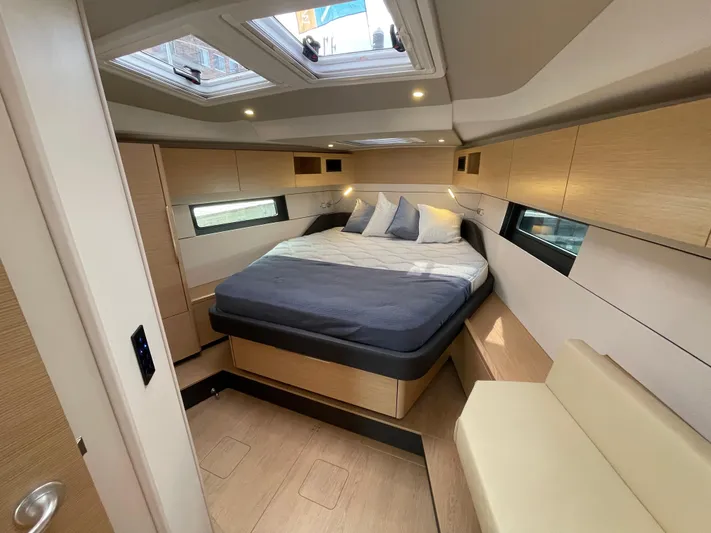 Uncorked Yacht Photos Pics Luxurious interior of 2023 Hanse 460 yacht with modern bedroom design.