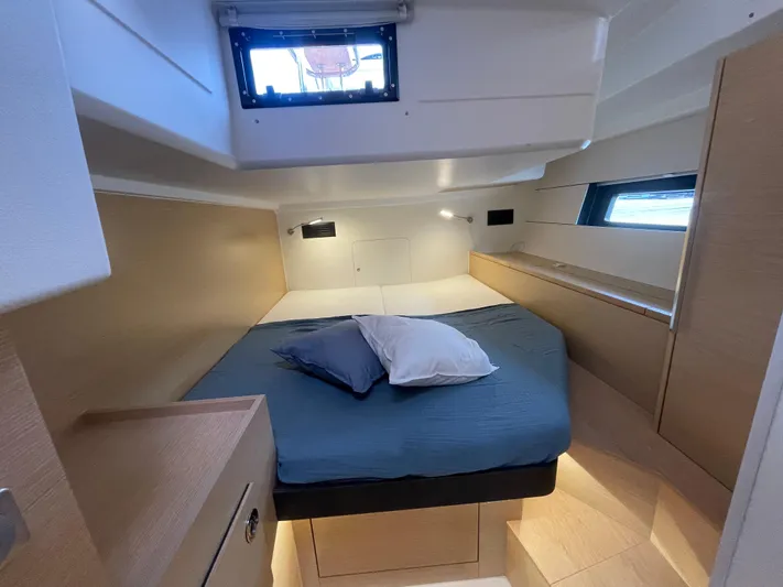 Uncorked Yacht Photos Pics Cozy cabin interior of 2023 Hanse 460 yacht with modern design and comfortable bedding.
