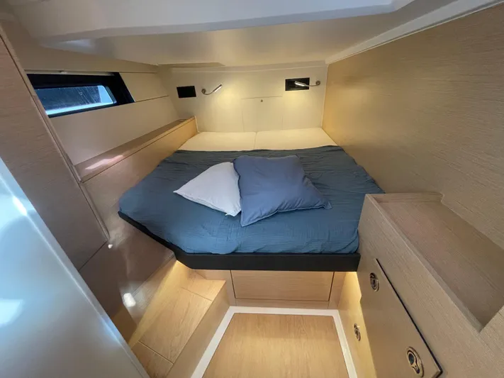 Uncorked Yacht Photos Pics Cozy cabin interior of 2023 Hanse 460 yacht with bed and storage.