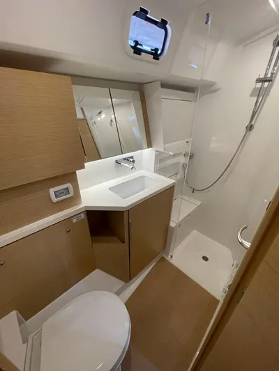 Uncorked Yacht Photos Pics Modern bathroom in 2023 Hanse 460 yacht with sleek fixtures and wood accents.