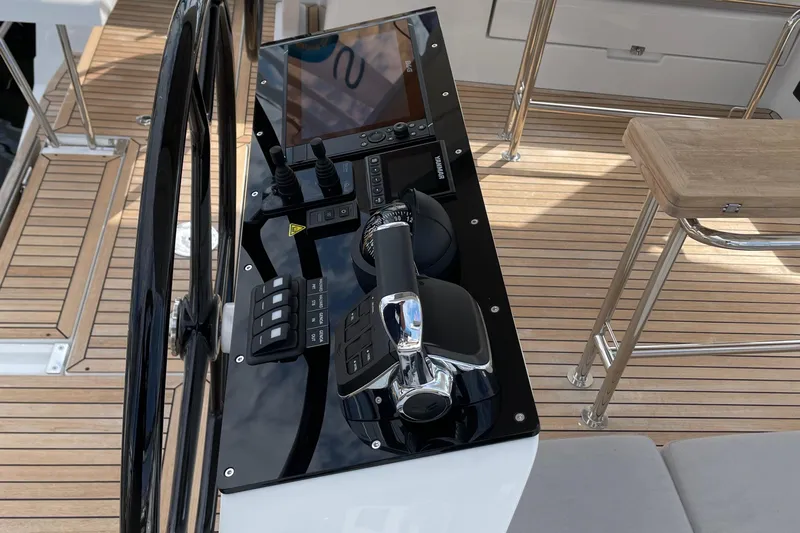 Uncorked Yacht Photos Pics 2023 Hanse 460 yacht helm with modern controls and sleek design.