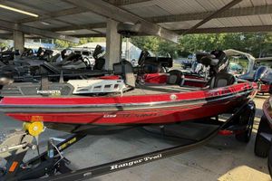2024 Ranger Z518 boat in red, parked under a shelter with Minn Kota Ultrex motor.