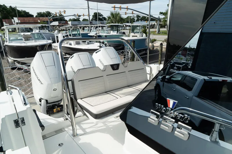 38 Explorer Yacht Photos Pics 2025 Wellcraft 355 boat with dual engines and sleek design, docked at a marina.