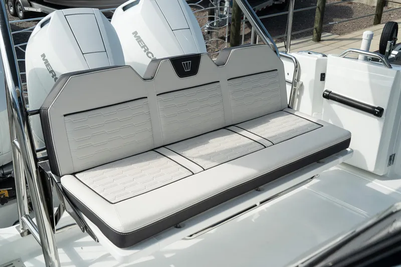 38 Explorer Yacht Photos Pics 2025 Wellcraft 355 boat seating with dual Mercury engines in the background.