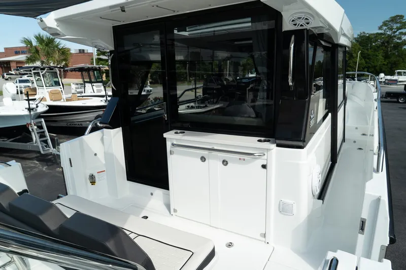 38 Explorer Yacht Photos Pics 2025 Wellcraft 355 boat with sleek design and modern features, docked outdoors.