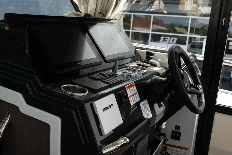 38 Explorer Yacht Photos Pics Helm of 2025 Wellcraft 355 boat with modern navigation screens and controls.