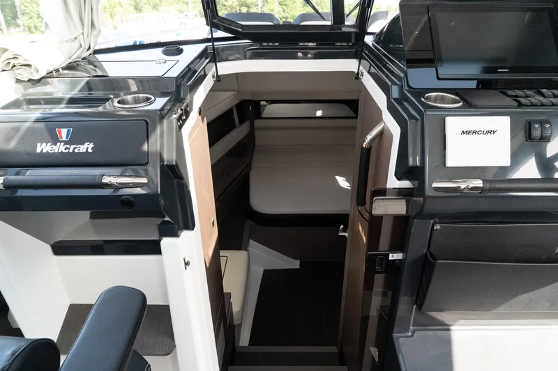 38 Explorer Yacht Photos Pics 2025 Wellcraft 355 boat interior with modern design and Mercury controls.