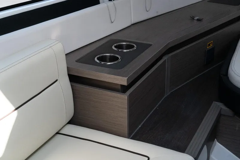 38 Explorer Yacht Photos Pics 2025 Wellcraft 355 interior with beige seating and dual cup holders.