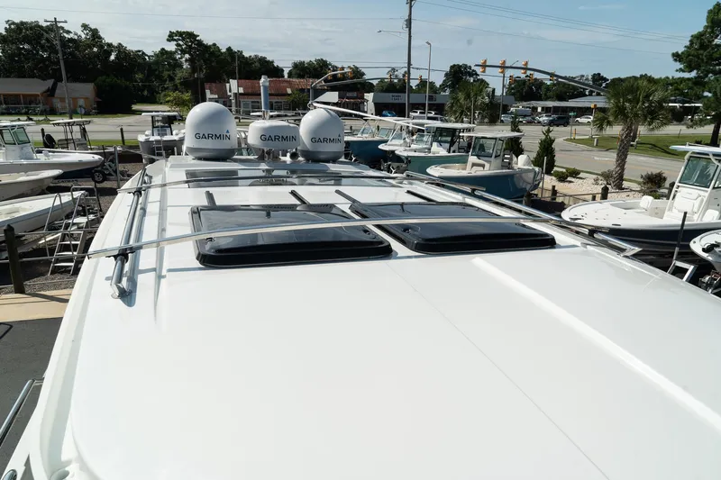 38 Explorer Yacht Photos Pics 2025 Wellcraft 355 boat with Garmin equipment on deck, docked in a marina.