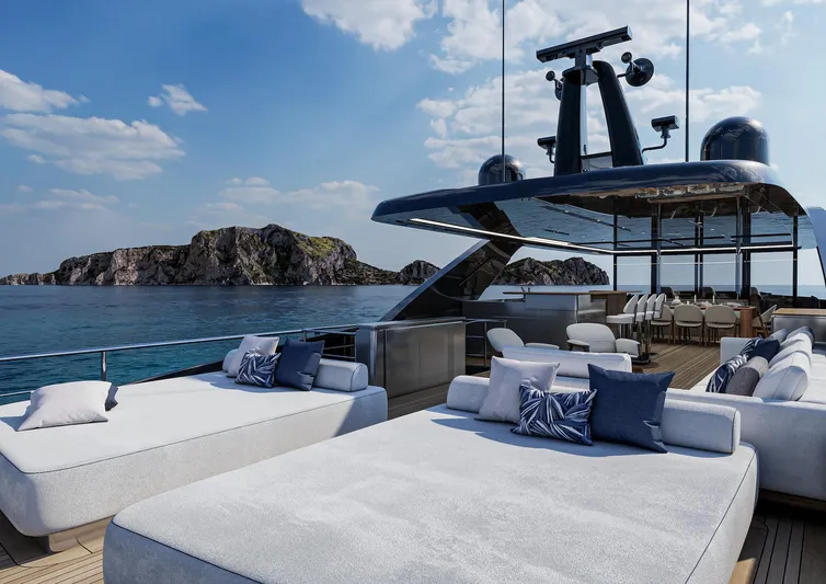 Viper 130 Yacht Photos Pics Luxurious 2027 ISA Viper 130 yacht deck with sunbeds, ocean view, and island backdrop.