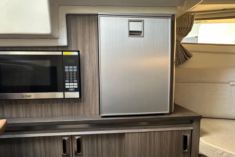  Yacht Photos Pics 2020 Sea Ray Sundancer 320 Outboard interior with microwave and compact fridge.