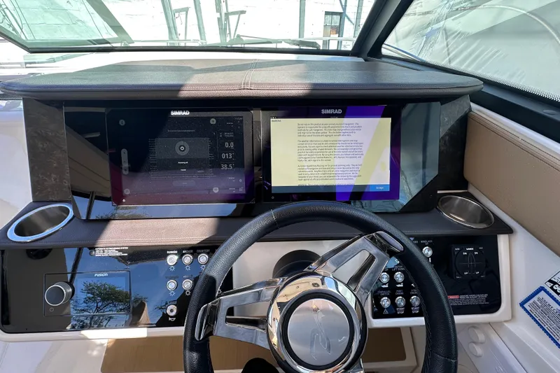  Yacht Photos Pics 2020 Sea Ray Sundancer 320 Outboard dashboard with Simrad displays and steering wheel.