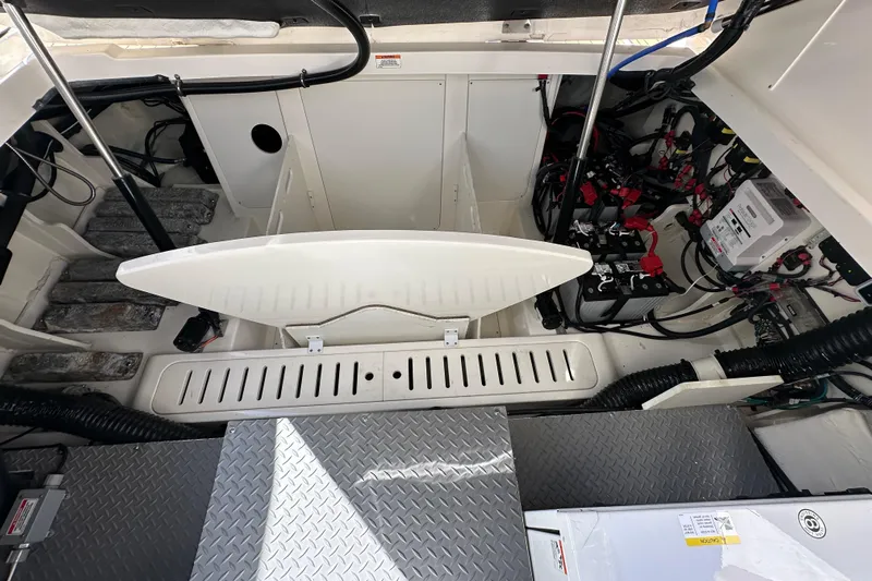  Yacht Photos Pics Engine compartment of 2020 Sea Ray Sundancer 320 Outboard, showcasing battery and wiring systems.