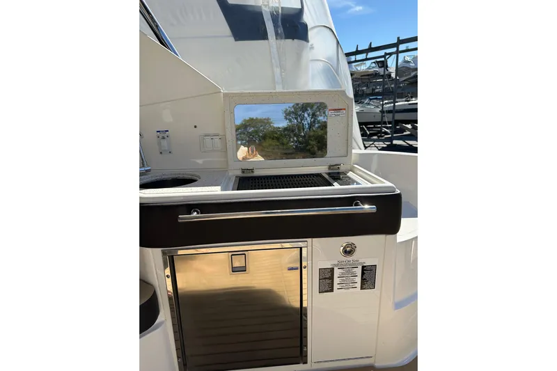  Yacht Photos Pics 2020 Sea Ray Sundancer 320 Outboard boat kitchen area with grill and storage.