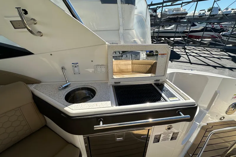  Yacht Photos Pics 2020 Sea Ray Sundancer 320 Outboard boat kitchenette with sink and grill.