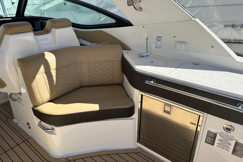  Yacht Photos Pics 2020 Sea Ray Sundancer 320 Outboard interior with seating and kitchenette area.