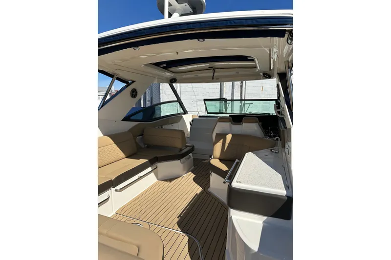  Yacht Photos Pics 2020 Sea Ray Sundancer 320 Outboard interior with beige seating and sleek design.