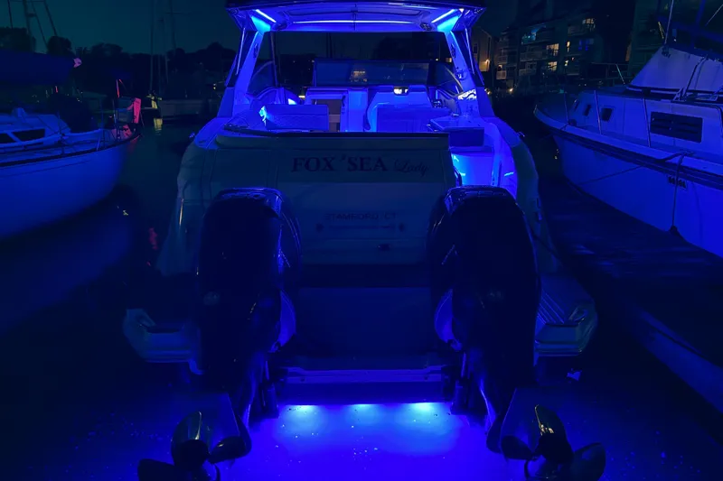  Yacht Photos Pics 2020 Sea Ray Sundancer 320 Outboard with blue LED lights at night dock.