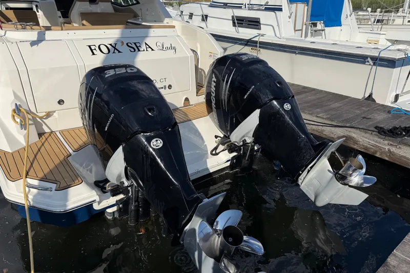 Yacht Photos Pics 2020 Sea Ray Sundancer 320 Outboard with twin Mercury engines docked at marina.