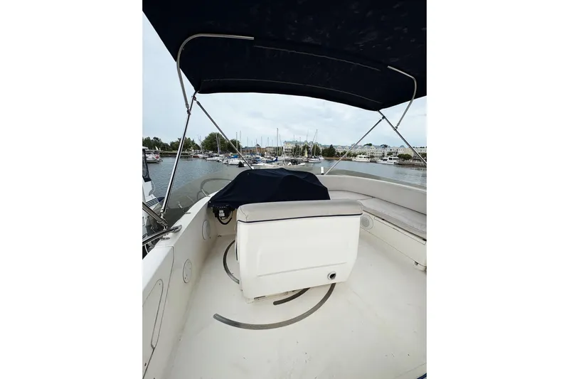 Pilot House Yacht Photos Pics 2003 Sealine F42/5 yacht with covered helm, docked in a marina.