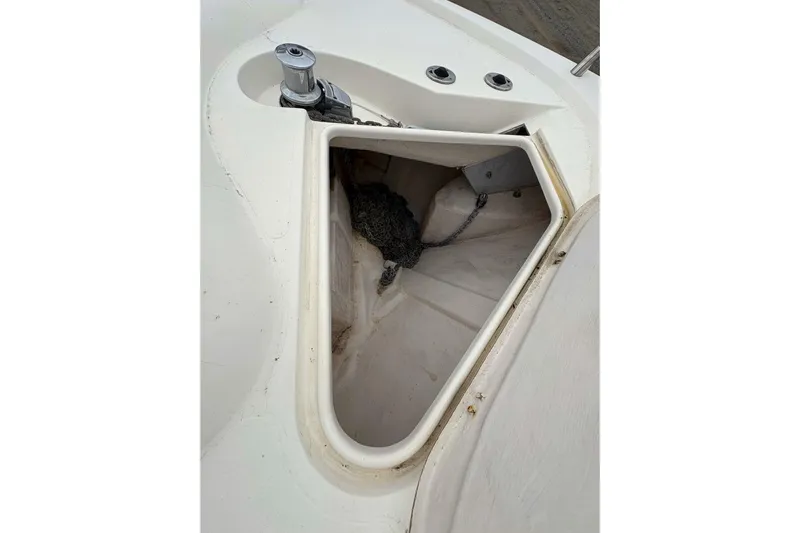 Pilot House Yacht Photos Pics Anchor locker of 2003 Sealine F42/5 yacht, featuring storage space and winch.