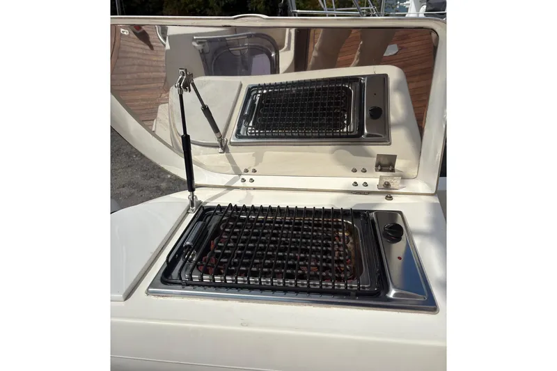 Pilot House Yacht Photos Pics Outdoor grill on a 2003 Sealine F42/5 yacht, featuring a sleek stainless steel design.