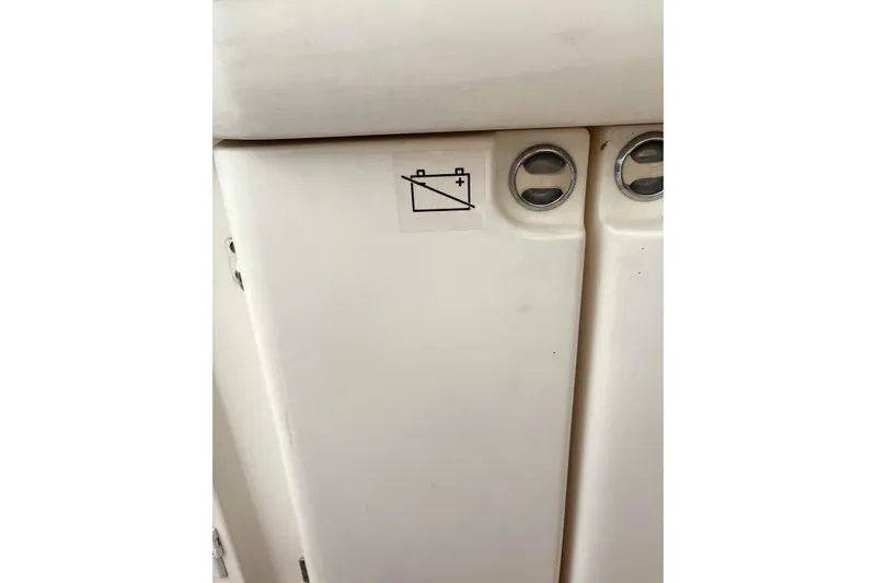 Pilot House Yacht Photos Pics Sealine F42/5 2003 boat interior with battery warning symbol on white panel.