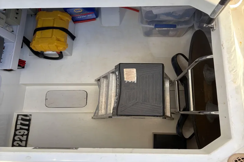 Pilot House Yacht Photos Pics Storage compartment of 2003 Sealine F42/5 yacht with ladder and equipment.