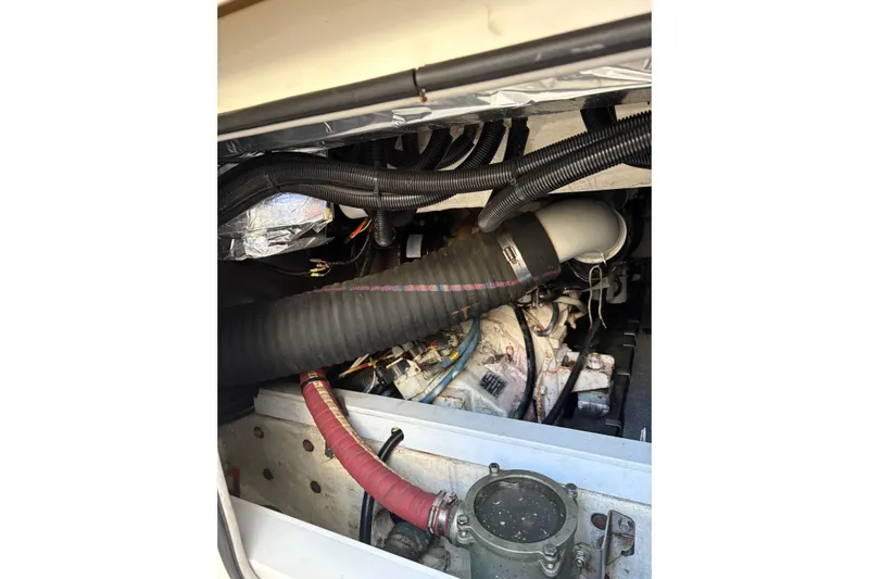 Pilot House Yacht Photos Pics Engine compartment of a 2003 Sealine F42/5 boat, showing hoses and components.