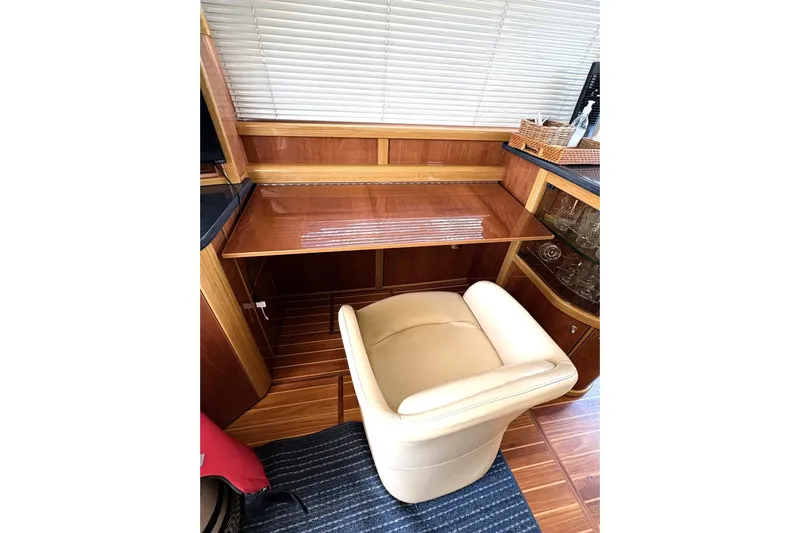 Pilot House Yacht Photos Pics Luxurious interior of 2003 Sealine F42/5 yacht with elegant wood and leather furnishings.